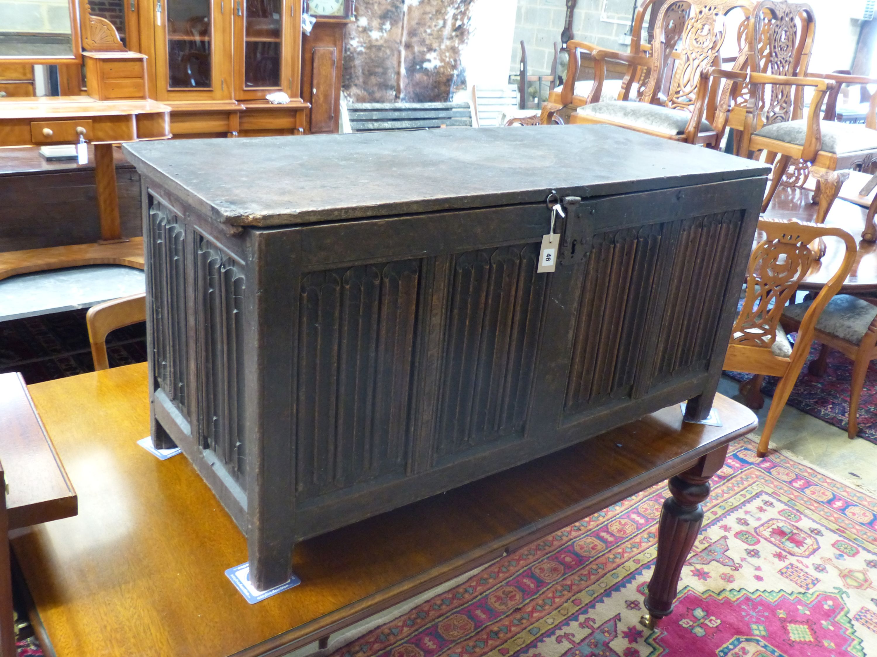 A carved and panelled oak chest, length 129cm, depth 51cm, height 63cm